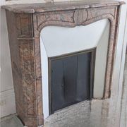 Pompadour fireplace in pink marble