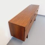 Vintage Scandinavian style row in rosewood and brass from the 60s
