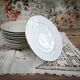 12 dessert plates in porcelain with double gold trim.