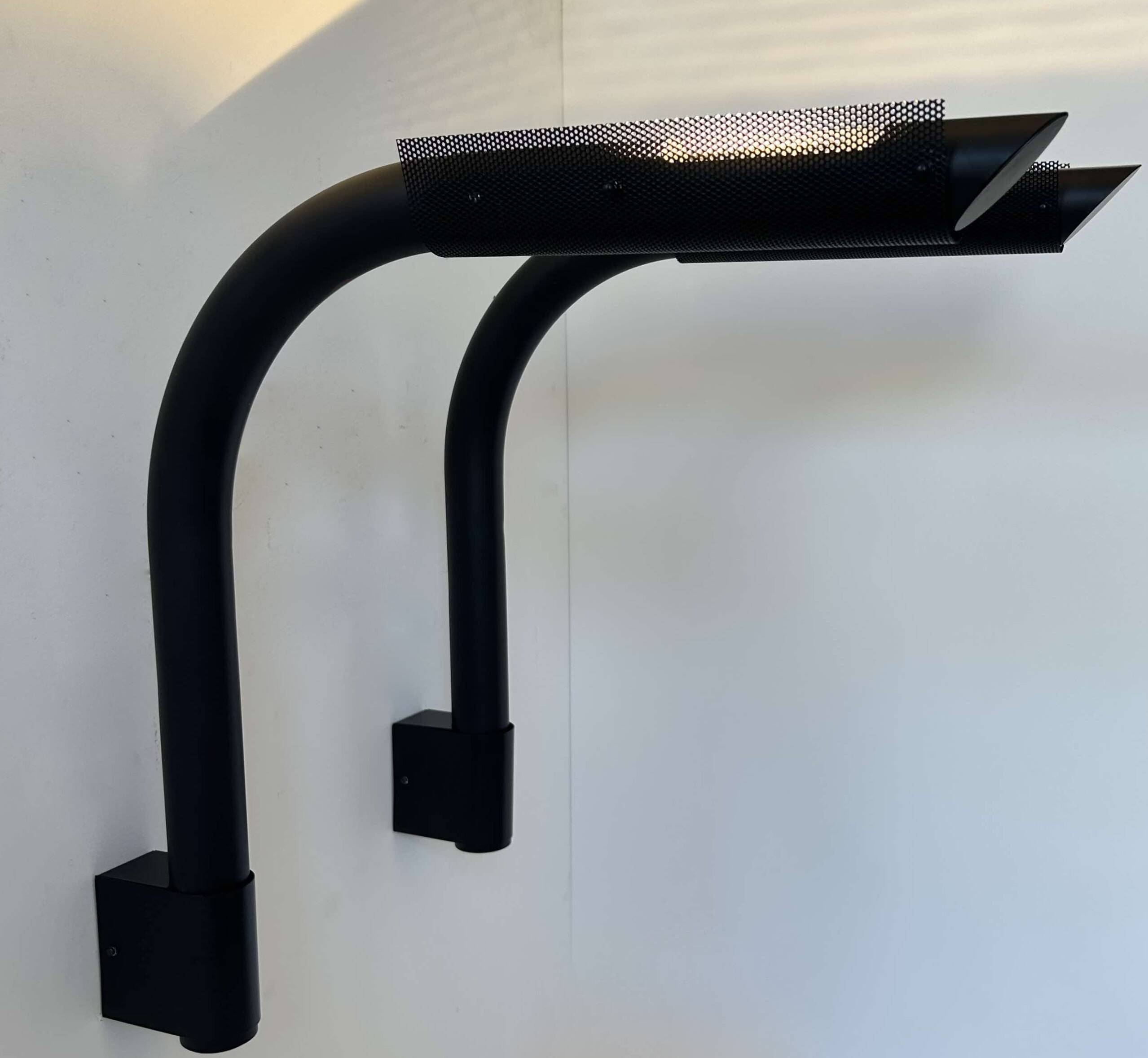 Pair of vintage wall lights, tubular and perforated black metal, Parscot France 1980