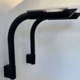 Pair of vintage wall lights, tubular and perforated black metal, Parscot France 1980