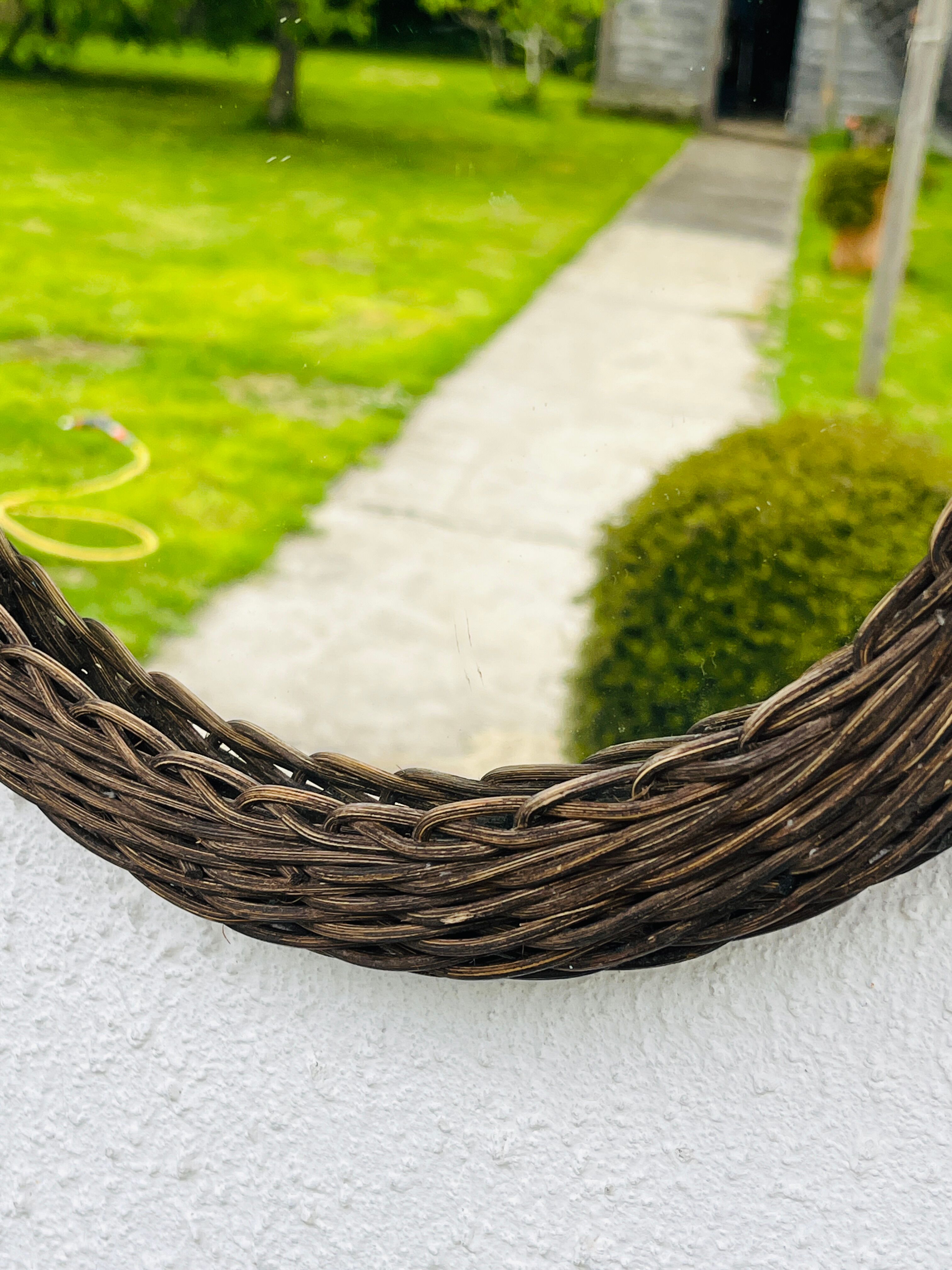 Vintage sun mirror in woven wicker
