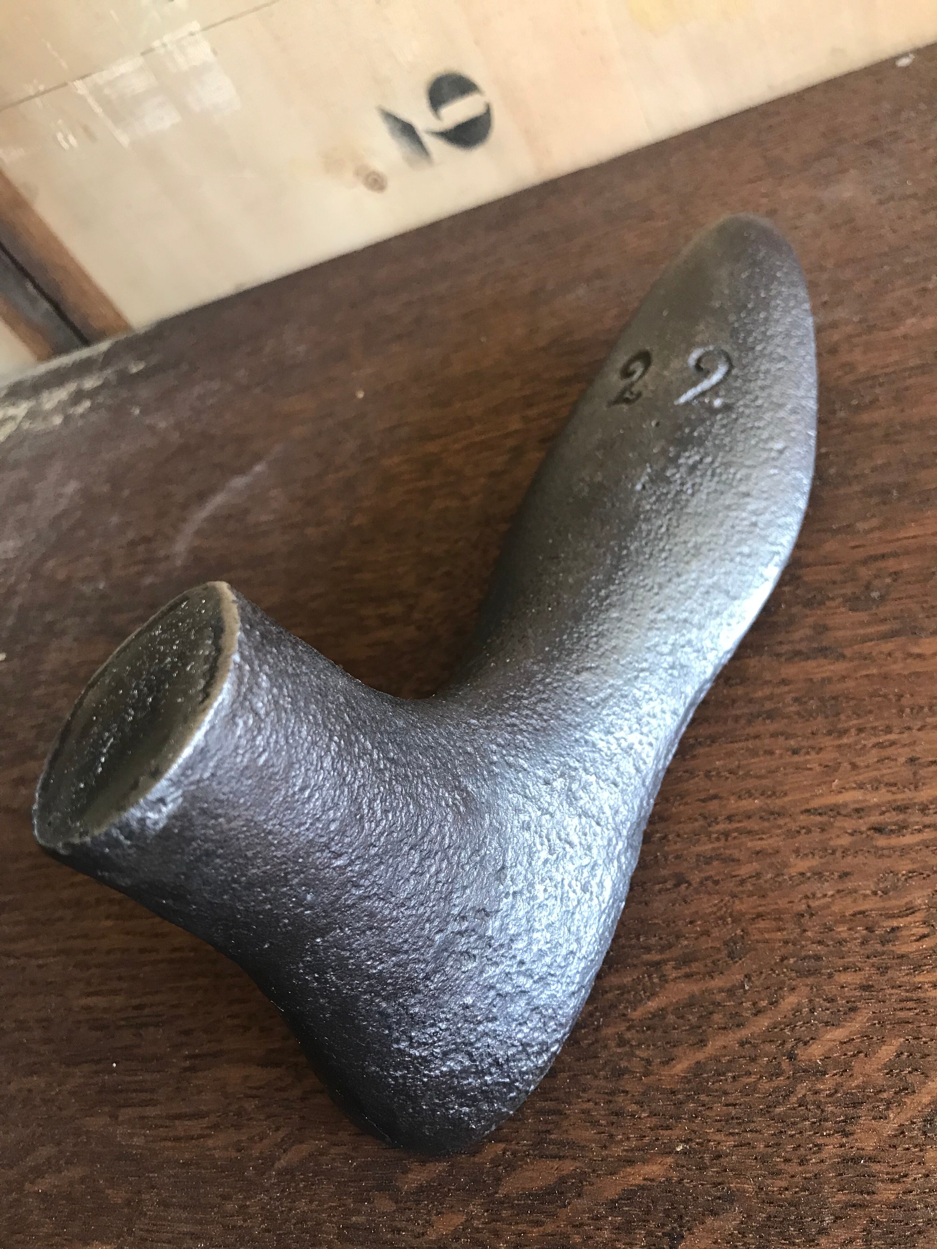Foot shape vintage metal shoemaker