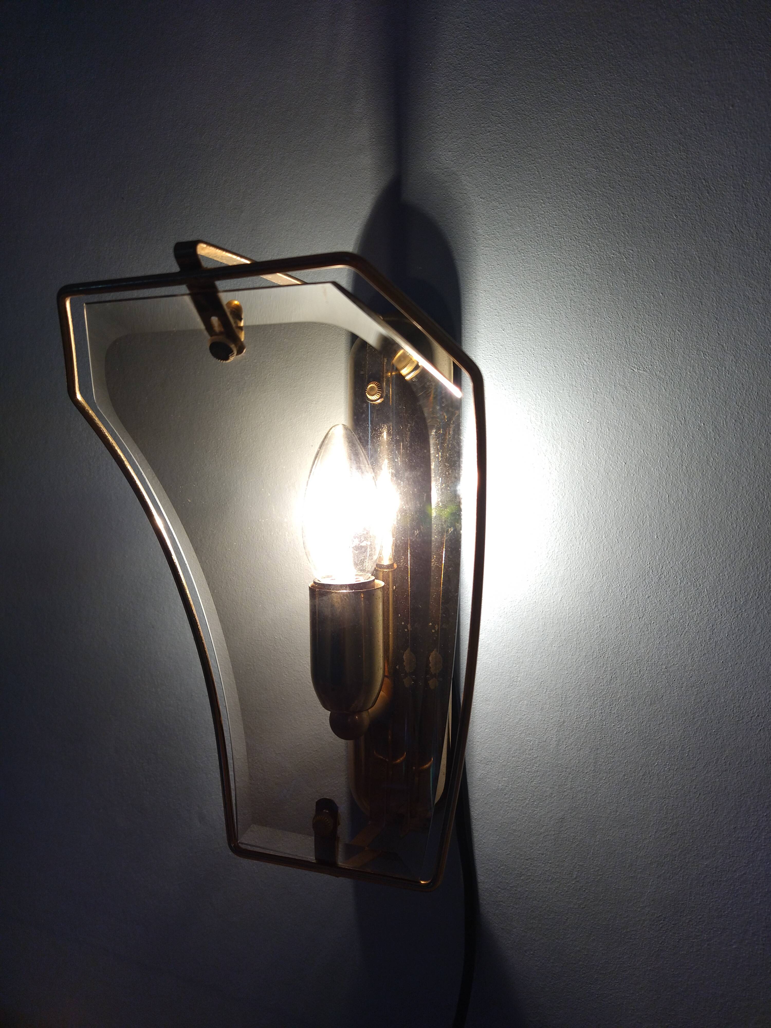 Pair of brass and curved glass wall lamps from the 80s