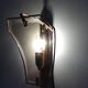 Pair of brass and curved glass wall lamps from the 80s