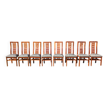 Set of 8 teak lounge chairs with high backs and zebra-striped seats