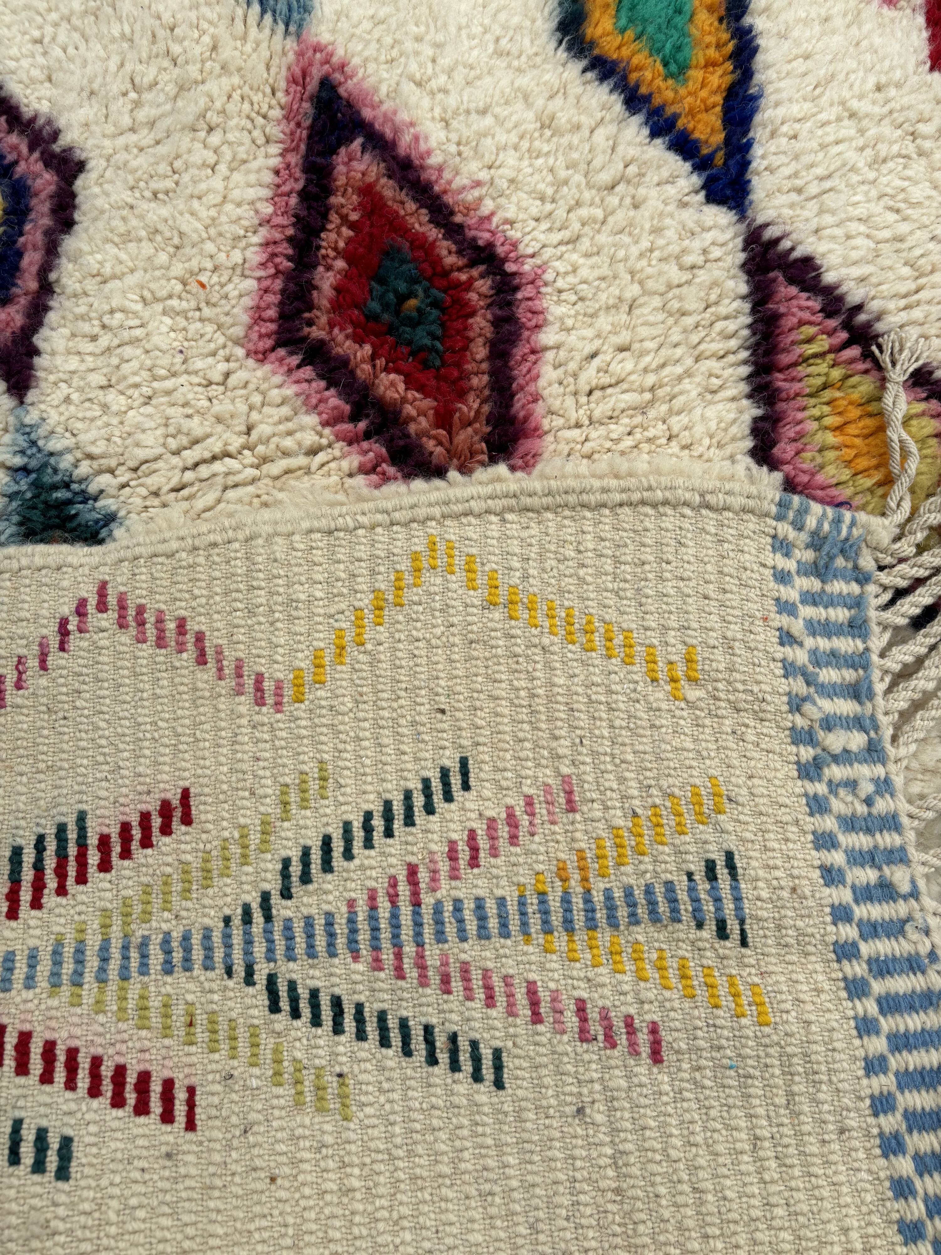 M'rirt Berber rug in cream wool with coloured patterns, 160 × 190 cm