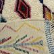 M'rirt Berber rug in cream wool with coloured patterns, 160 × 190 cm