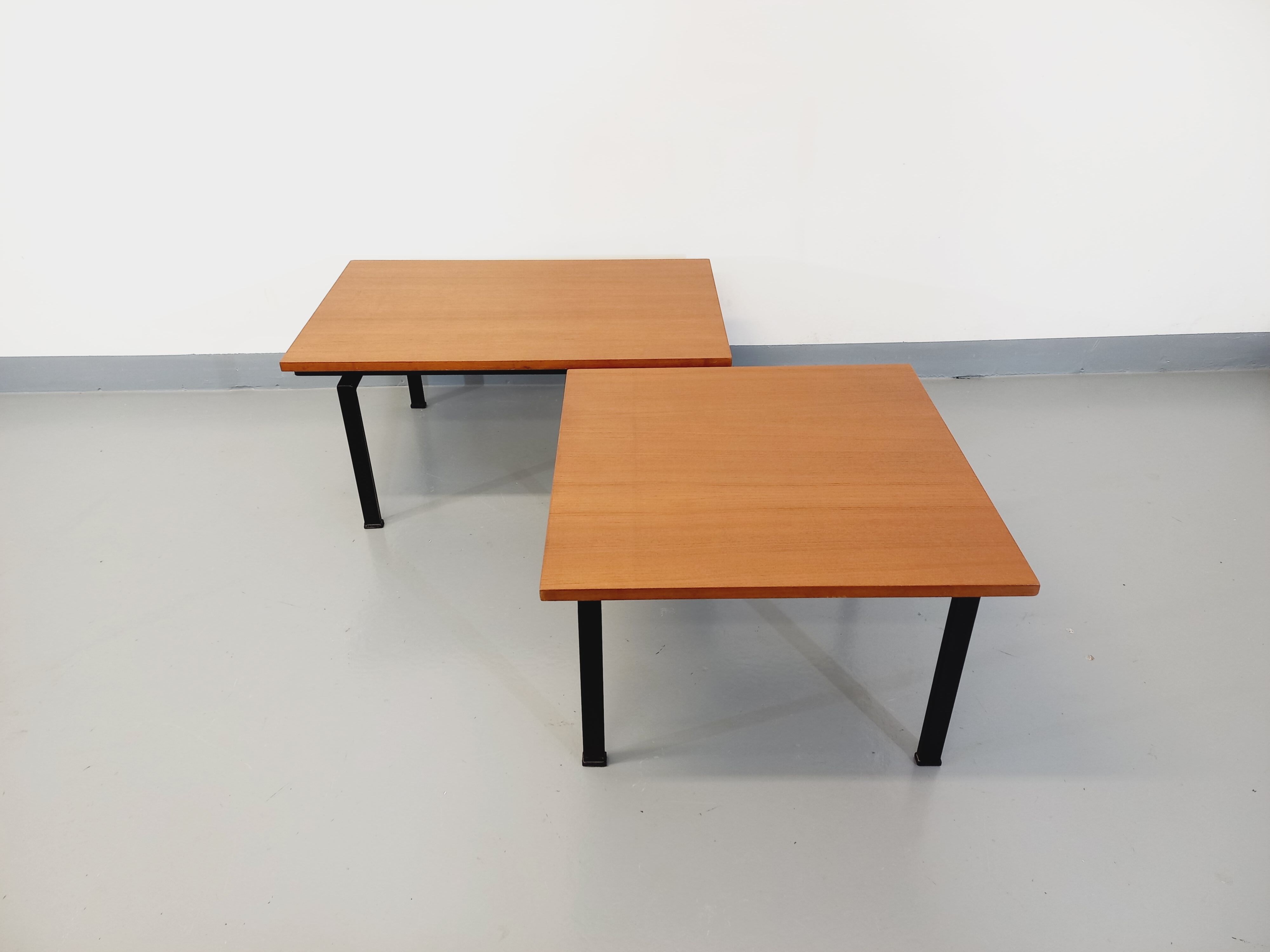 Suite of two vintage modernist Isa coffee tables in teak and black metal from the 60s
