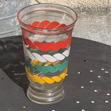 Vase en verre transparent et dore et lignes sérigraphies rouge, blanc, vert et jaune vintage 1960