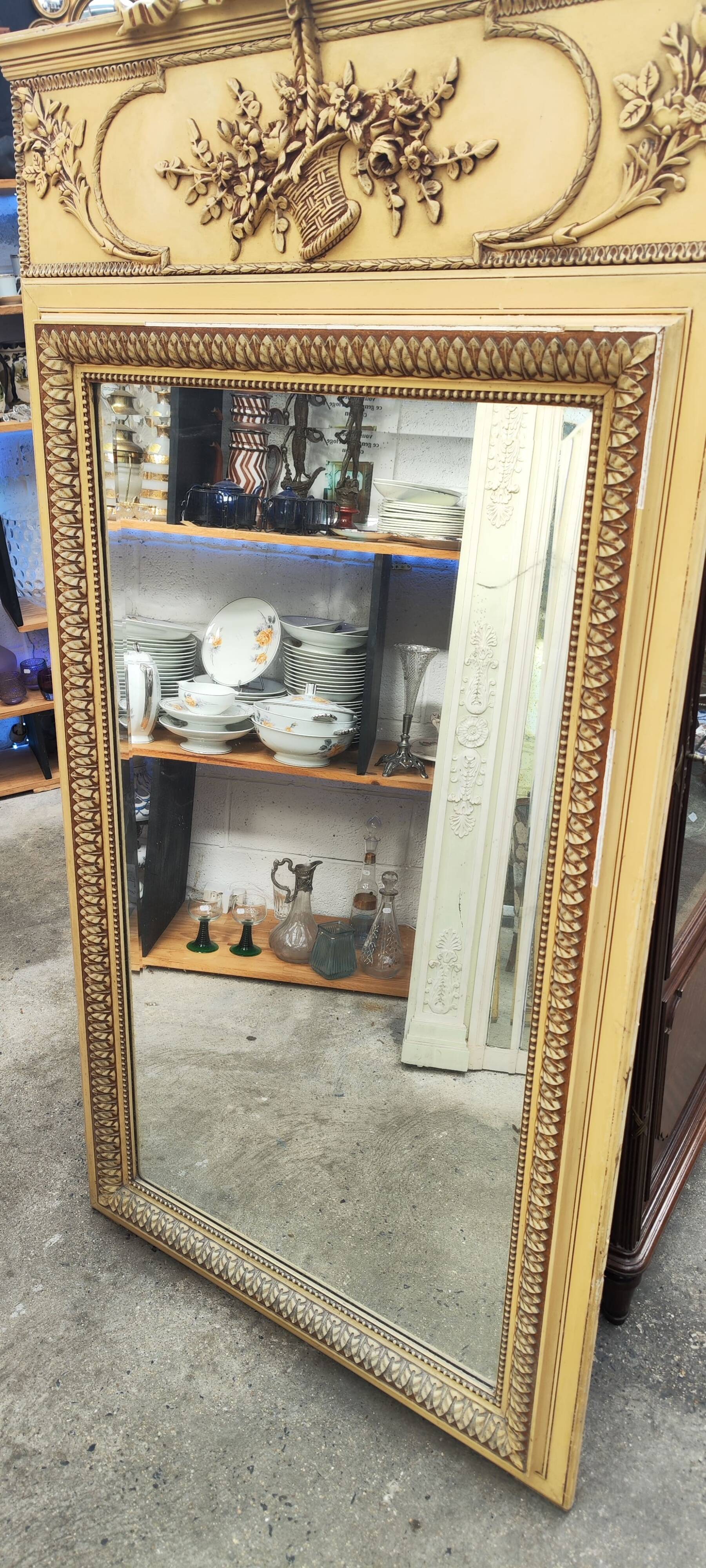 Old large Louis XVI style trumeau mirror with pediment and floral basket knot
