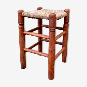 Old mulched stool with turned wooden legs