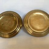 Pair of brass cellar rat candlesticks mascarons