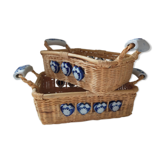 Two rattan panniers with handles and vintage ceramic decorations