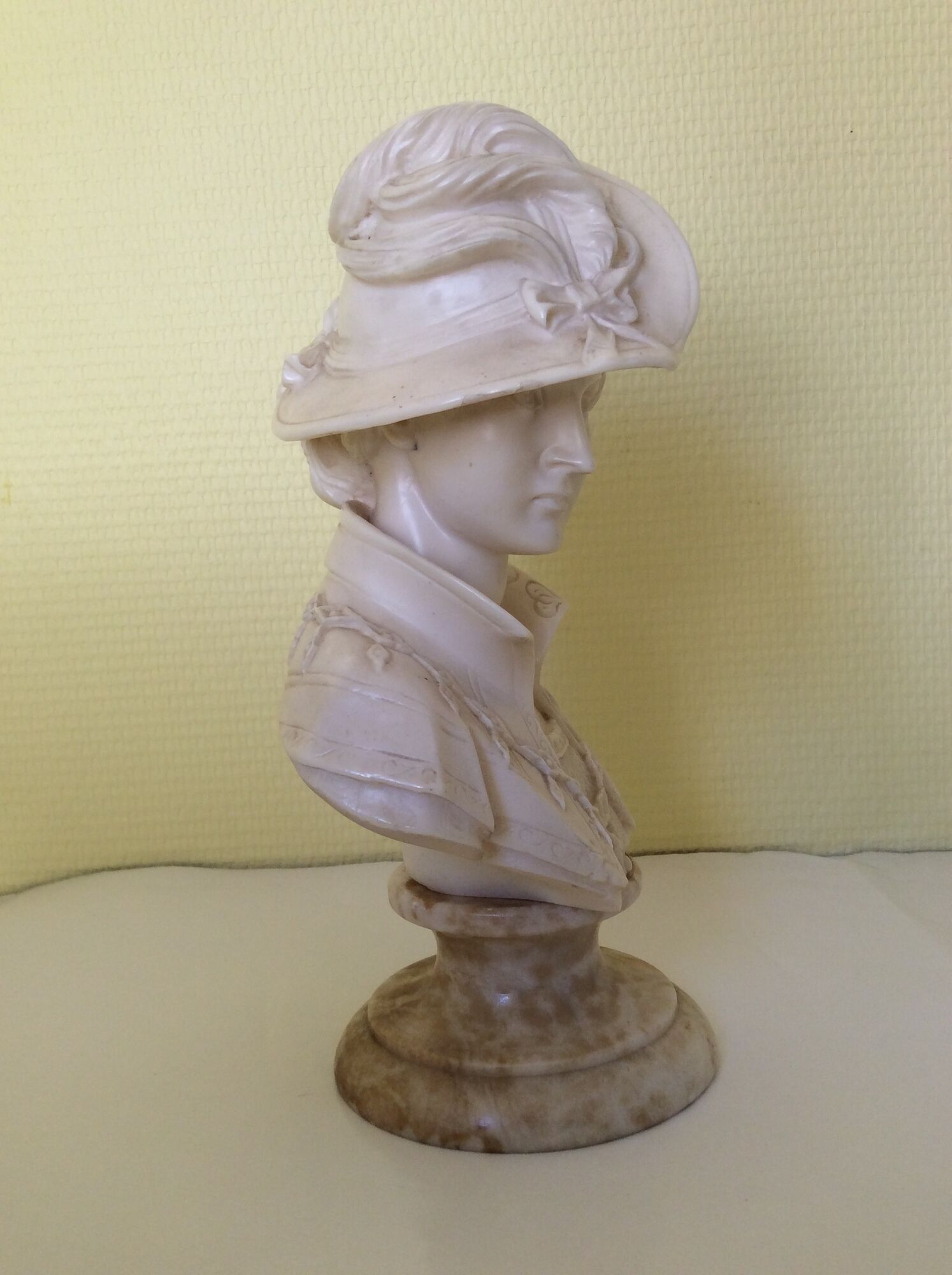 Bust of a young woman in the hat of A. Giannelli
