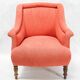 Napoleon III salon armchair in brick red linen with a tufted footrest.