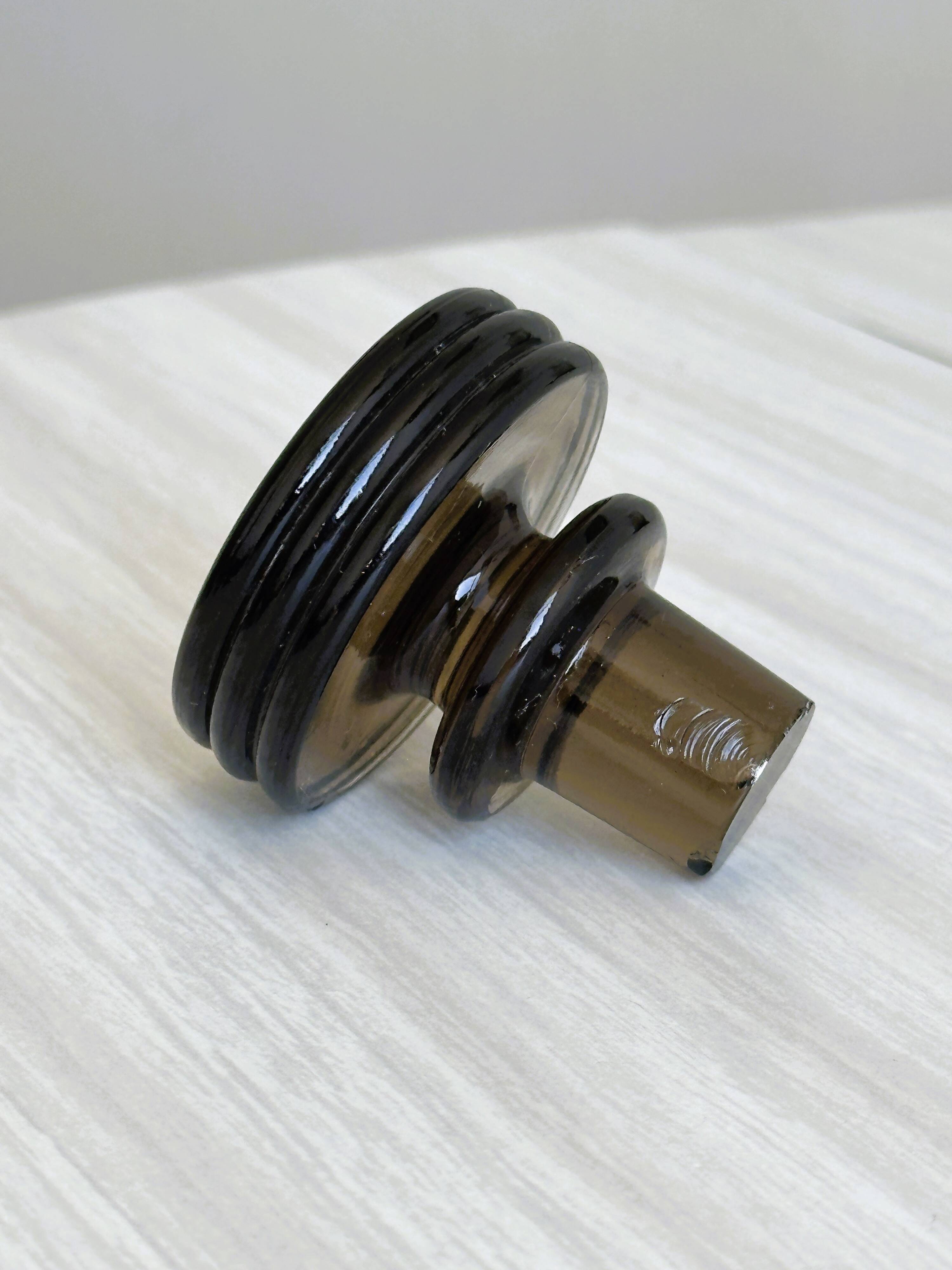 Carafe, old smoked glass bottle with sculpted stopper.