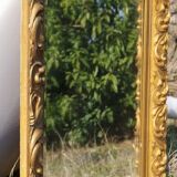 Wooden mirror decorated with gold from the 1920s