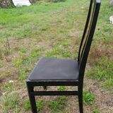 Octagonal table paul michel and its black lacquered chairs and elm magnifying glass