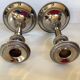 Pair of silver-plated zinc metal candlesticks