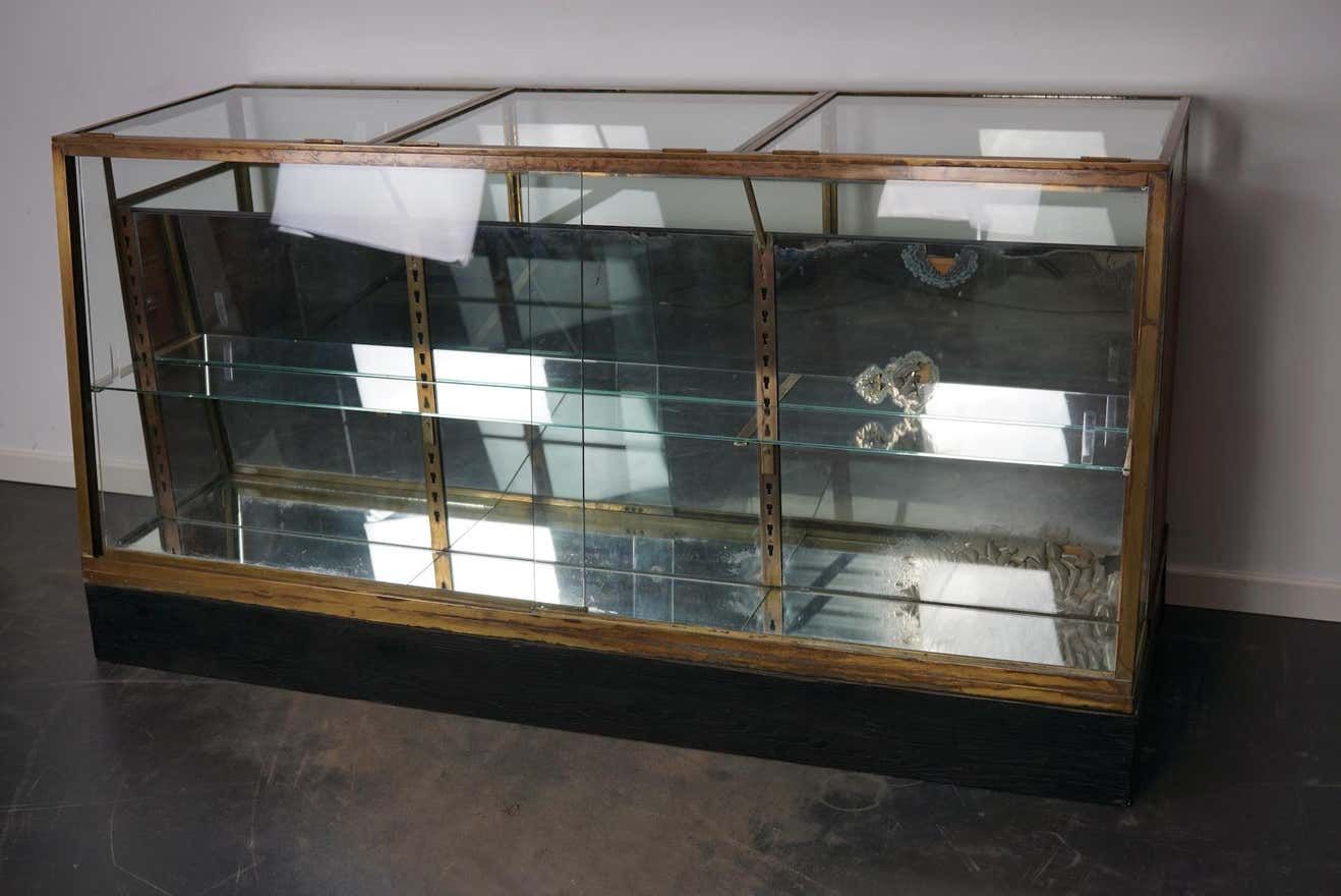 Counter or shop window in oak glass and brass France around 1920