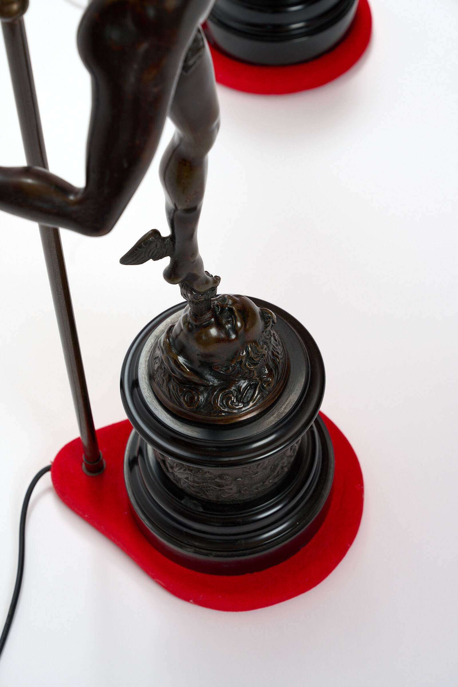 Pair of bronze lamps with red shades