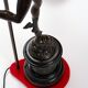 Pair of bronze lamps with red shades