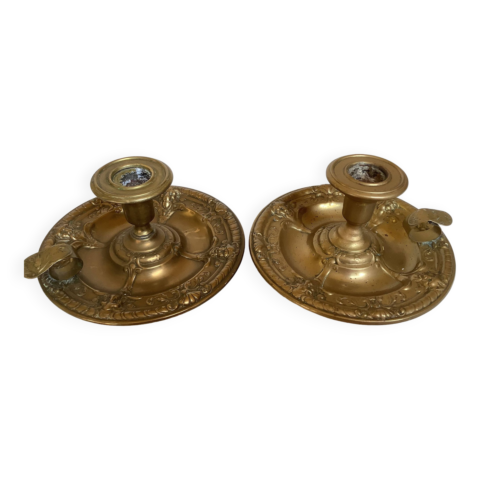 Pair of brass cellar rat candlesticks mascarons