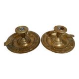 Pair of brass cellar rat candlesticks mascarons