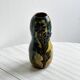 Very colorful glazed earthenware vase, old vase with floral decoration.