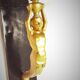 Corner wall lamp console with a golden cast iron djinn