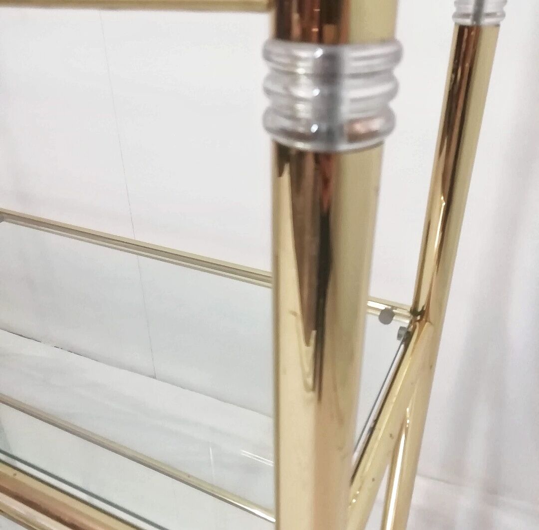 Hollywood Regency brass and glass shelf with elephant heads from the 1970s