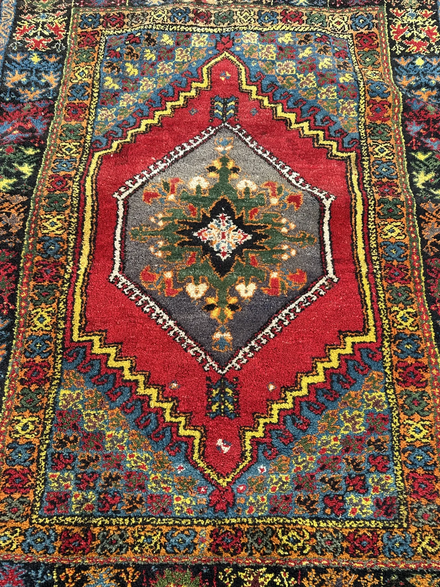 Old Moroccan carpet, made of natural wool and handwoven.
