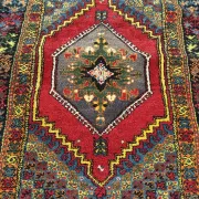 Old Moroccan carpet, made of natural wool and handwoven.