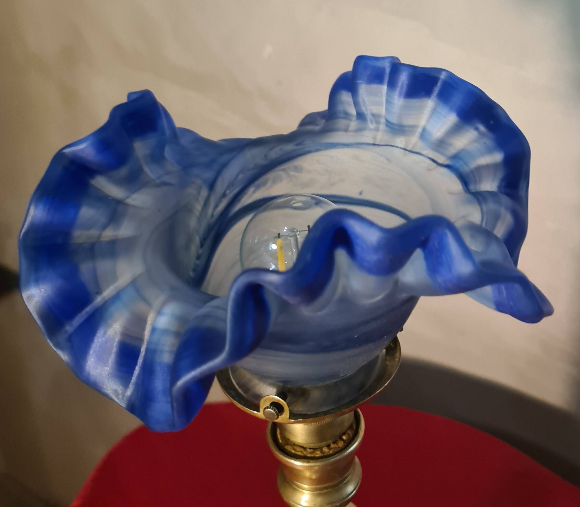etched brass lamp with a blue satin glass tulip shade, signed Vianne 36x16