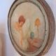 Ancient oval painting of a sleeping woman in oil on wood panel.
