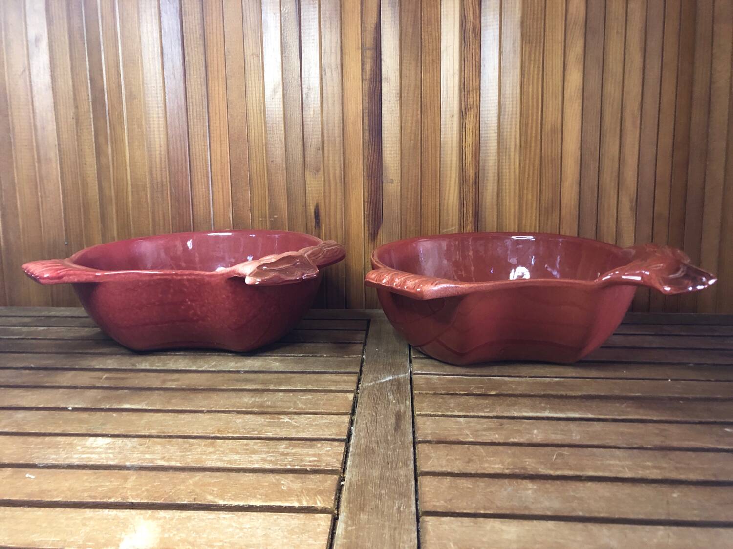 Pair of red ceramic hen dish