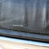 Pollock black leather reclining armchair with fixed ends