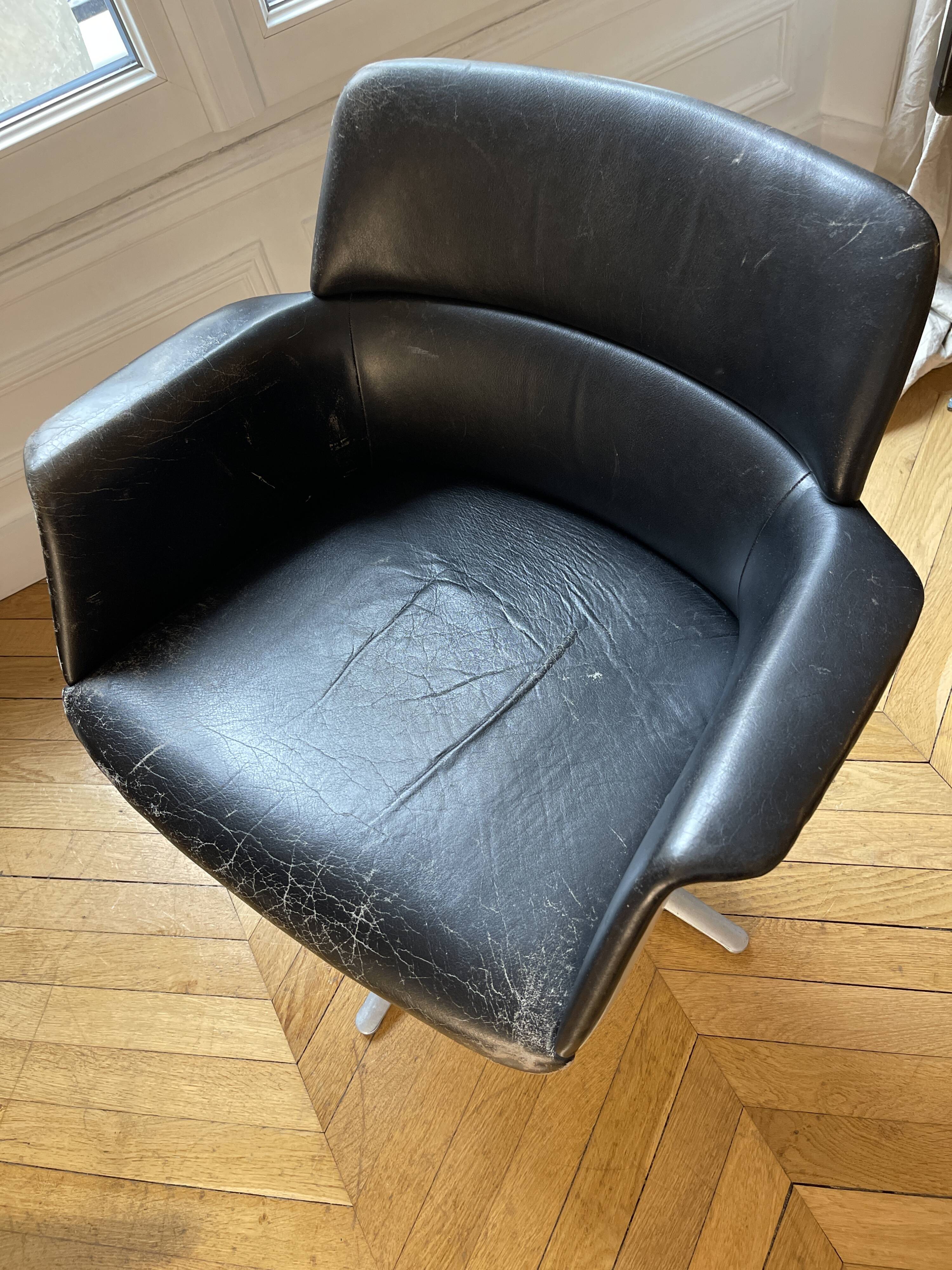 Swivel leather armchair