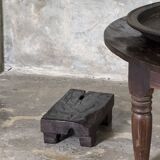 Coffee table, round antique Indonesian teak table with straight legs.