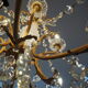 Chandelier 12 lamps with grapevines in crystal, bronze and regulated