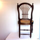 Lyre-shaped Chair bedded in natural wood with folder