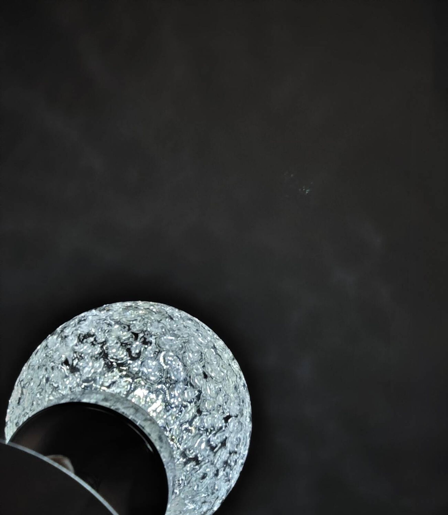 Duo of textured globe lamps with a large play of light.