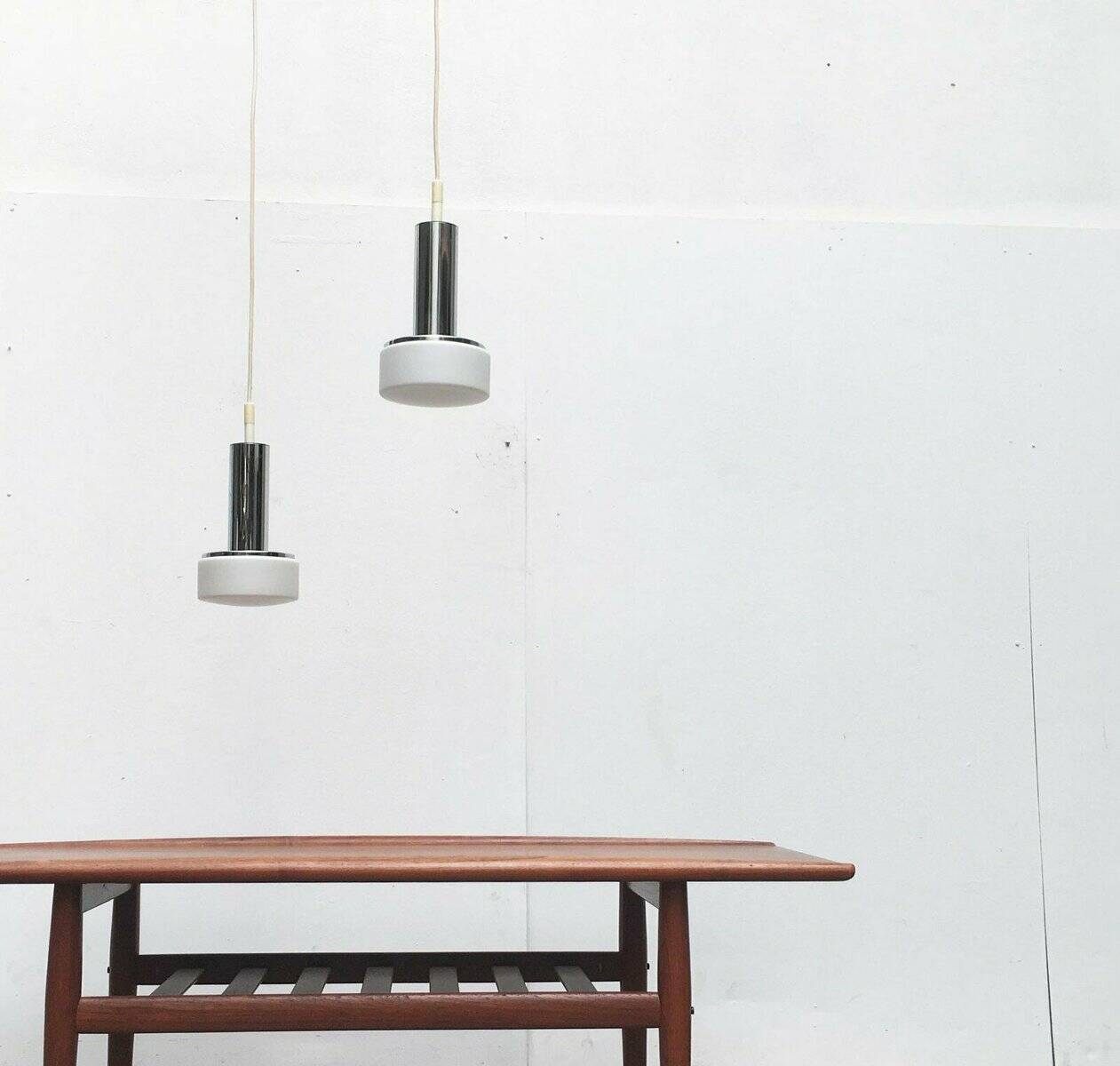 Suspended glass and chrome lamps model P105 German Mid-Century Space Age from the 1960s by Staff, set of 2.