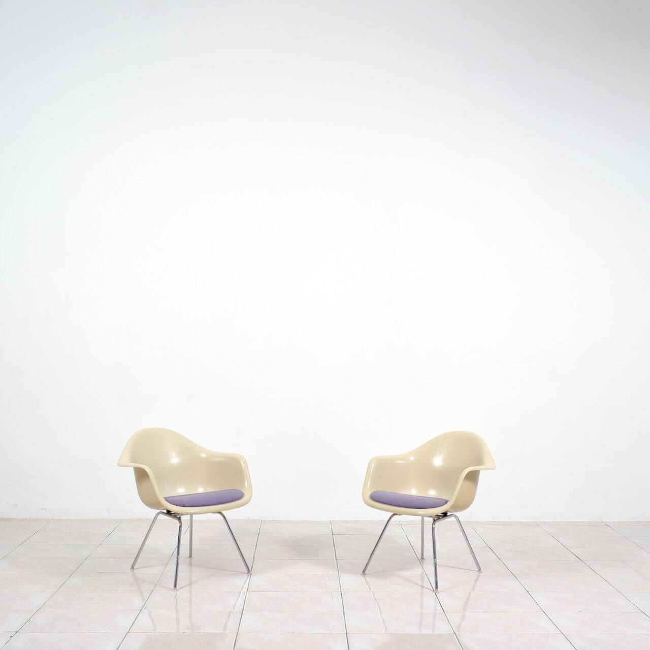 4 Eames DAX fiberglass lounge chairs with purple upholstery by Herman Mille