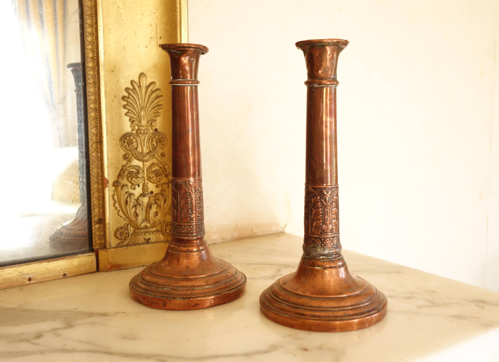 Pair of antique copper candlesticks