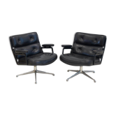 Pair of black leather executive chairs by Charles and Ray Eames.