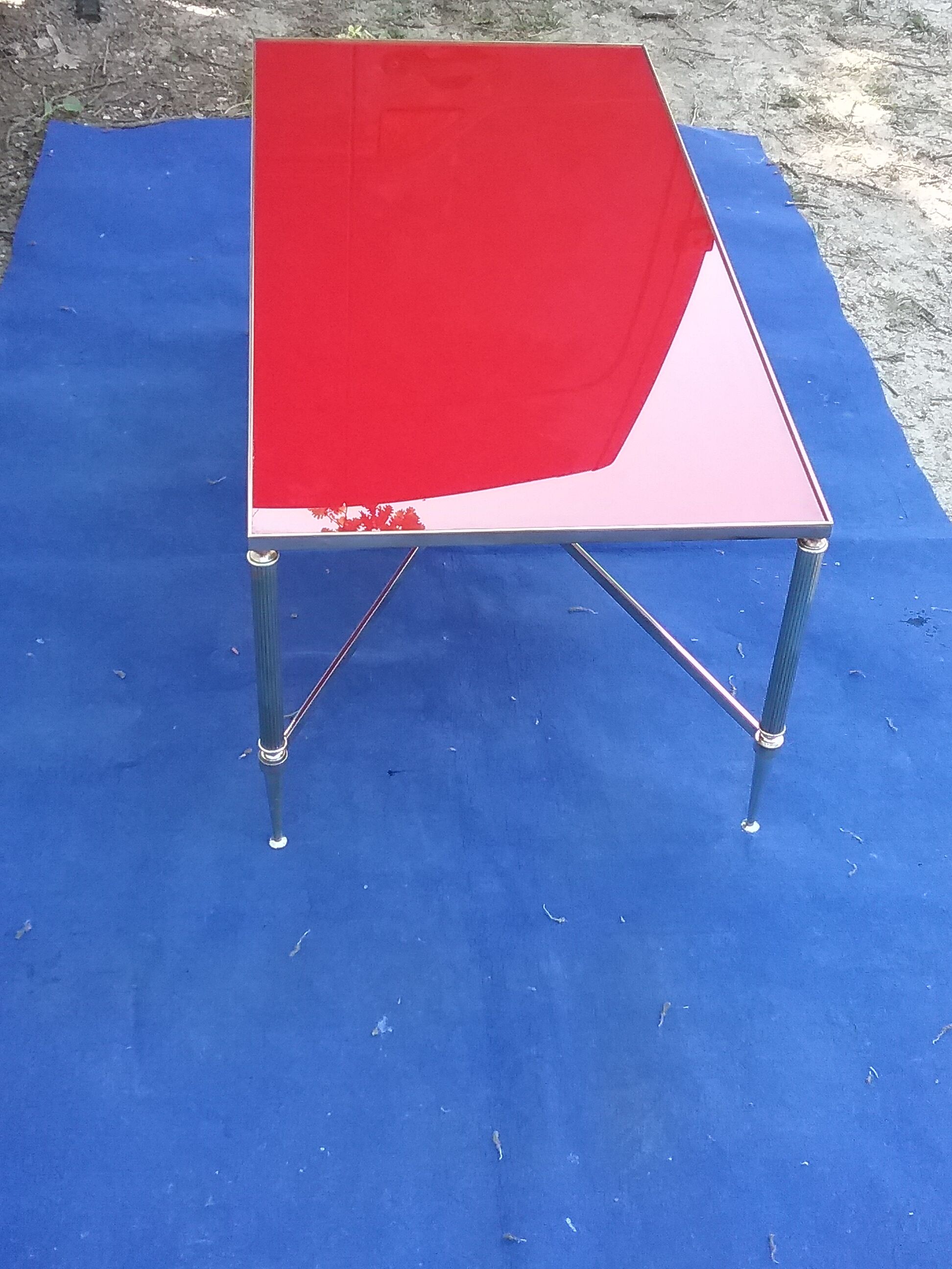Brass coffee table with red glass top