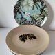 Set of 7 porcelain plates, gold foliage & jungle