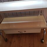 Rolling serving table with drawer